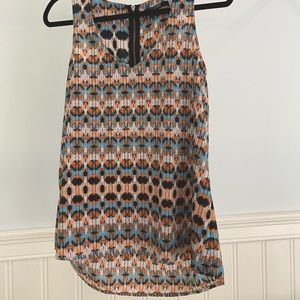 Orange, teal, and black 19 Cooper tank